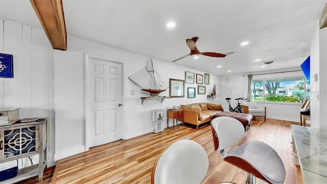 living area with recessed lighting, wood finished floors, visible vents, and ceiling fan