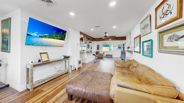 living room featuring recessed lighting, visible vents, wood finished floors, and a ceiling fan