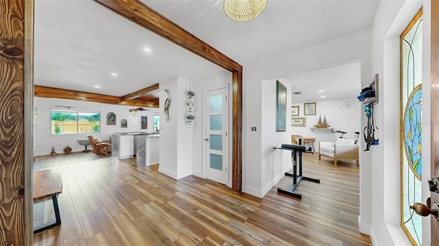 entryway featuring recessed lighting, baseboards, beam ceiling, and wood finished floors