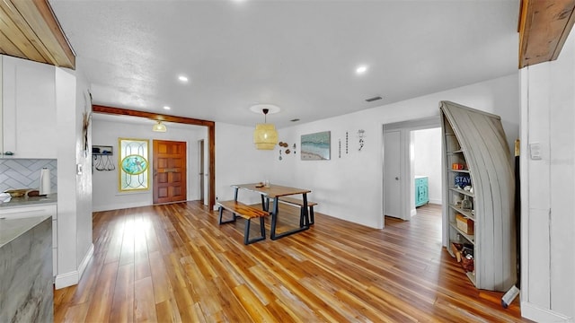 foyer entrance featuring light wood-style flooring, recessed lighting, and visible vents