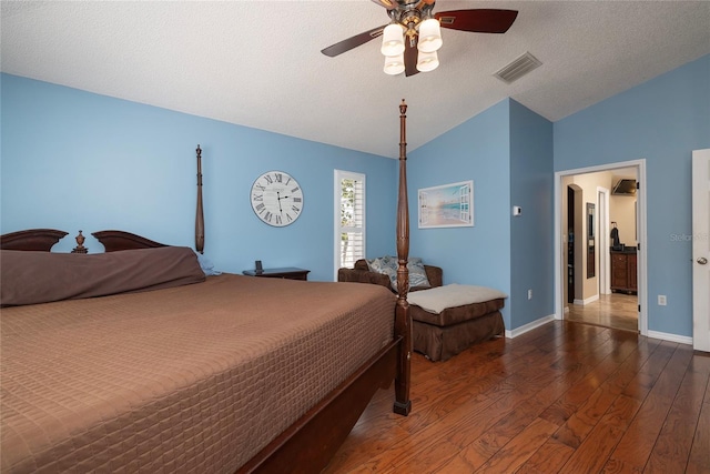 bedroom featuring visible vents, wood finished floors, baseboards, lofted ceiling, and ceiling fan