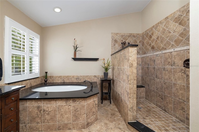 full bathroom featuring a garden tub and walk in shower