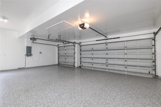 garage featuring electric panel and a garage door opener