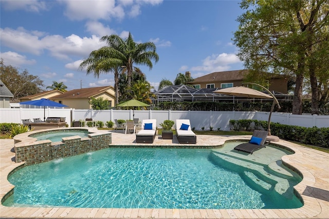 view of pool featuring a fenced in pool, an in ground hot tub, a fenced backyard, and a patio area