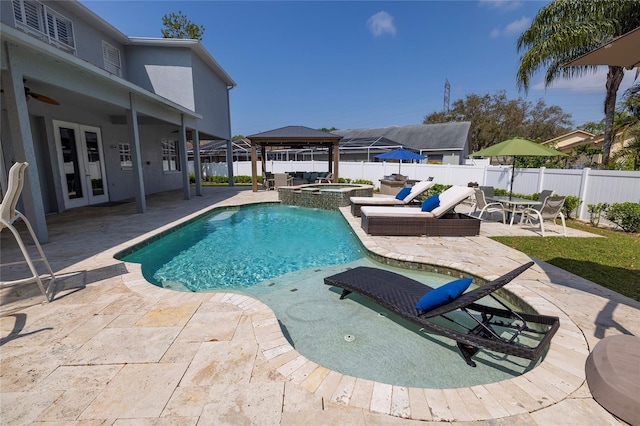 view of pool featuring a patio, a fenced backyard, a gazebo, french doors, and ceiling fan