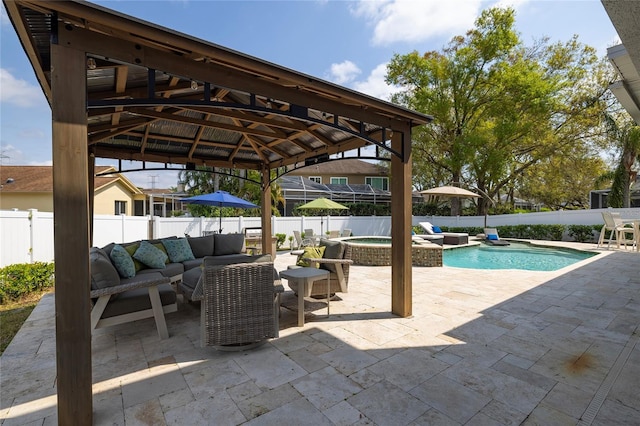 view of patio with an outdoor living space, a fenced backyard, a gazebo, a fenced in pool, and an in ground hot tub