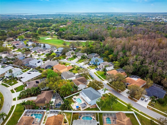 bird's eye view featuring a forest view and a residential view