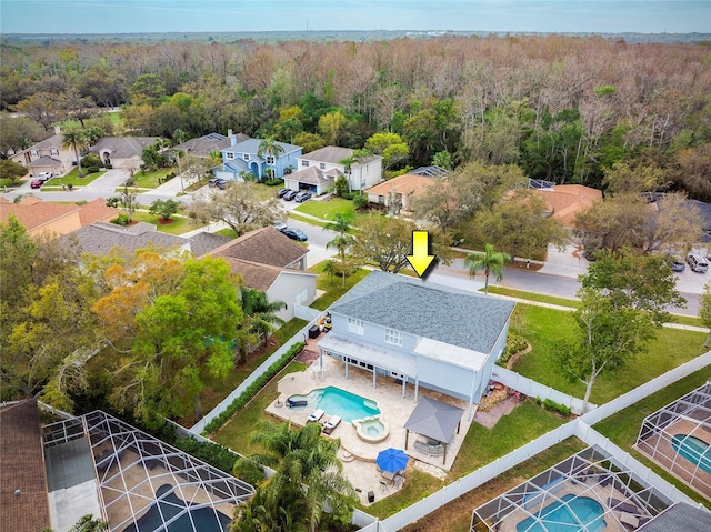 bird's eye view featuring a residential view and a forest view