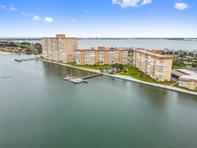 drone / aerial view featuring a view of city and a water view