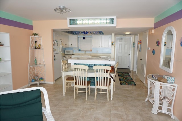 dining room with light tile patterned floors