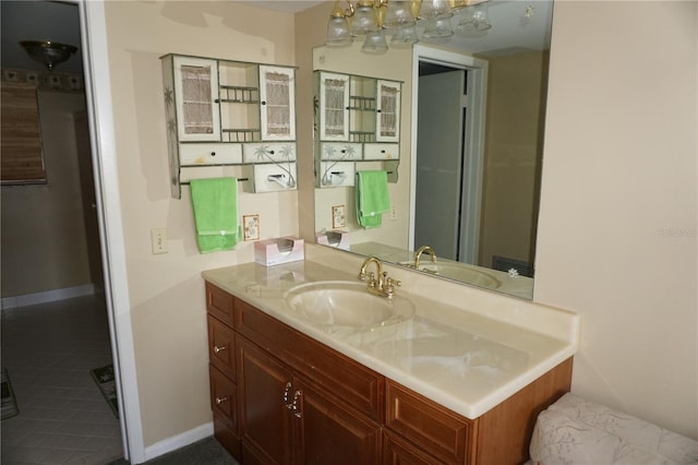 bathroom featuring vanity and baseboards