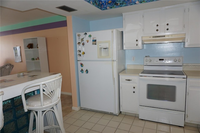 kitchen featuring white appliances, visible vents, light countertops, under cabinet range hood, and white cabinetry