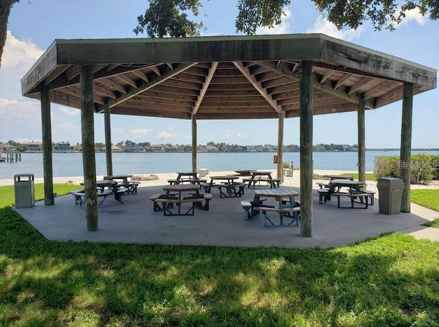 view of home's community featuring a gazebo, a yard, a patio, and a water view