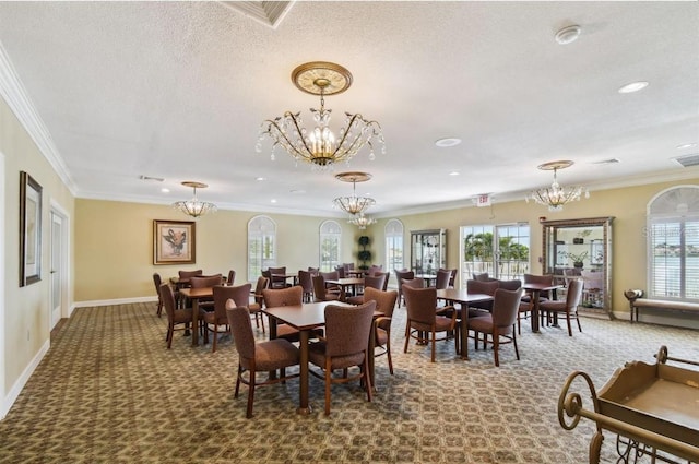 dining room featuring crown molding, a notable chandelier, and carpet floors