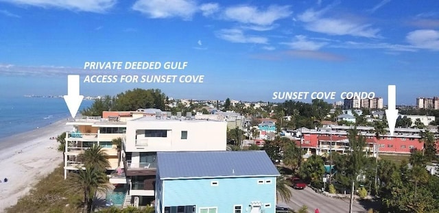 drone / aerial view of waterfront with a beach