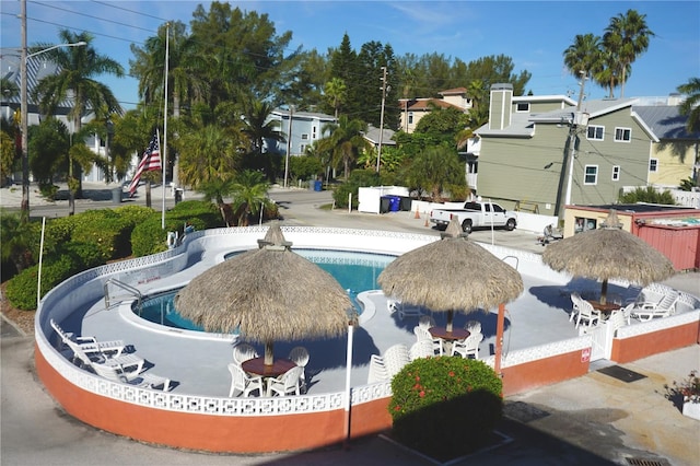 view of community with a pool and a patio