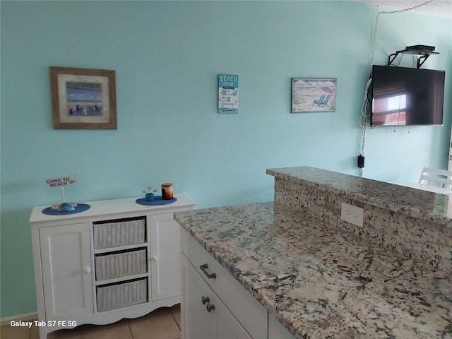 bathroom featuring tile patterned flooring and vanity