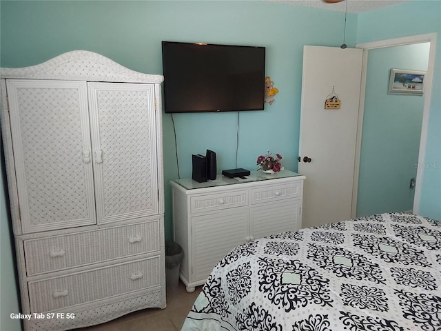 bedroom with tile patterned floors