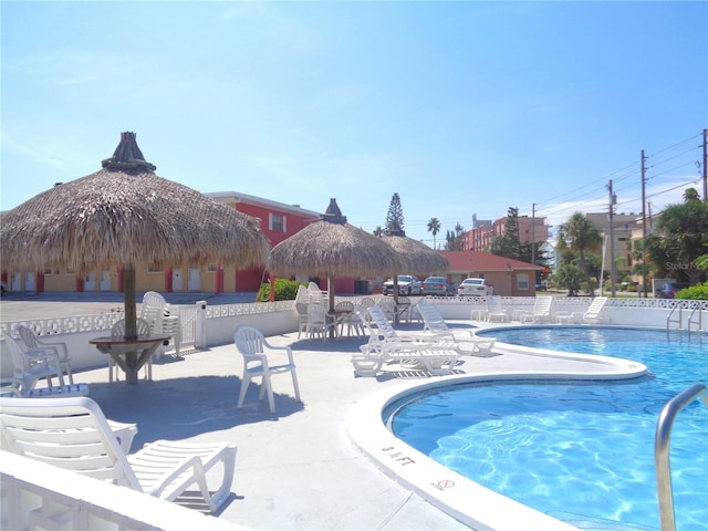 community pool featuring a patio and a gazebo