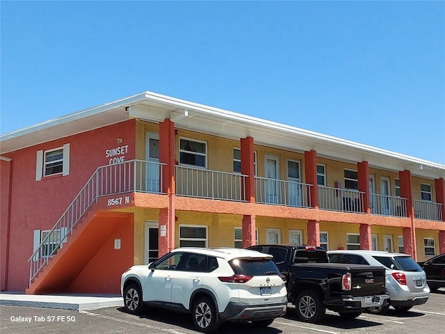 view of property with uncovered parking