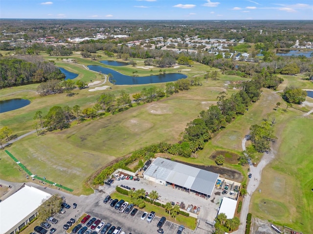 bird's eye view with view of golf course and a water view