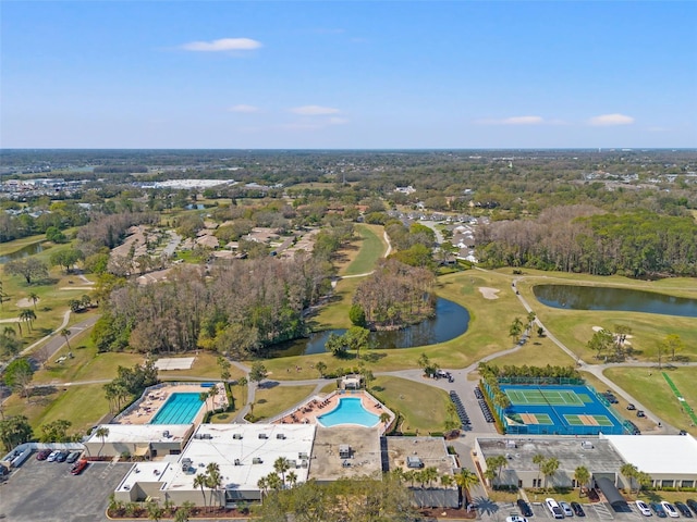 aerial view featuring golf course view and a water view