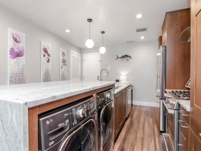 laundry area with visible vents, dark wood finished floors, laundry area, recessed lighting, and washer and dryer