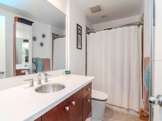 bathroom with tile patterned floors, visible vents, a shower with curtain, and vanity