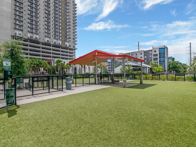 view of community featuring fence