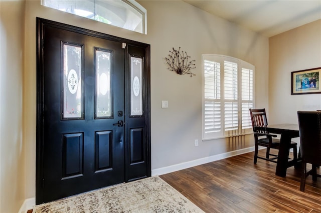 entryway with baseboards and dark wood-style flooring