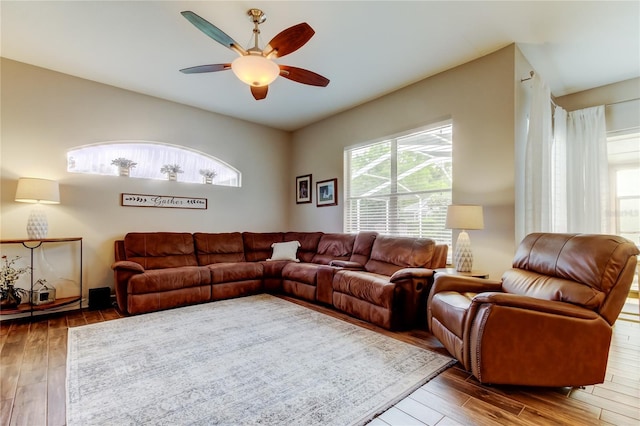 living area featuring wood finished floors and ceiling fan