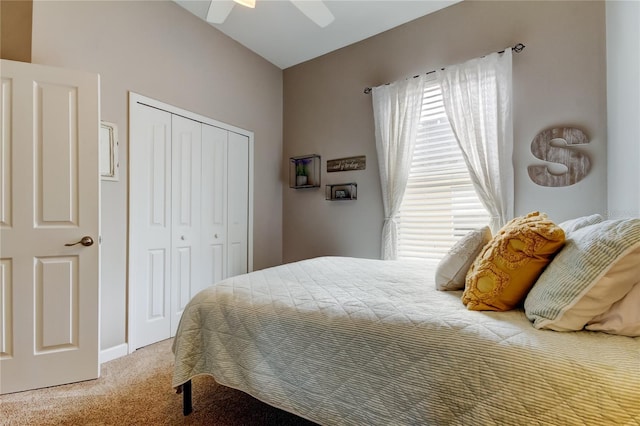 bedroom with a closet, light carpet, and a ceiling fan