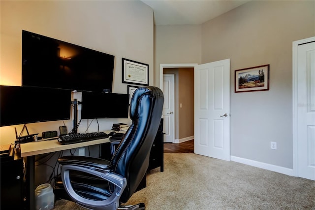 office area featuring baseboards and carpet floors