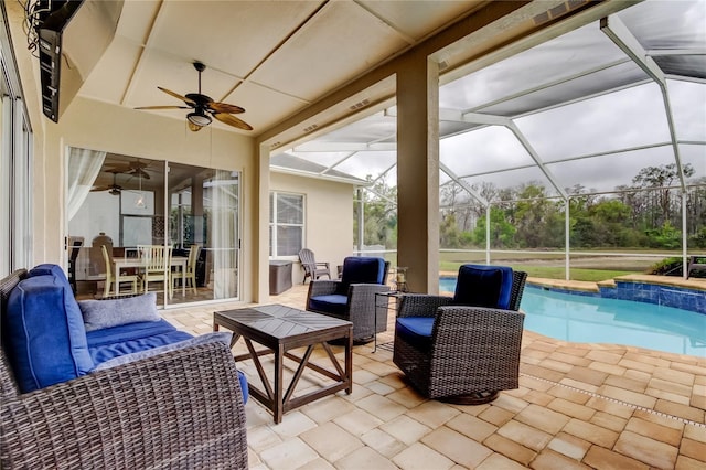 view of patio featuring glass enclosure, a ceiling fan, an outdoor pool, and an outdoor hangout area