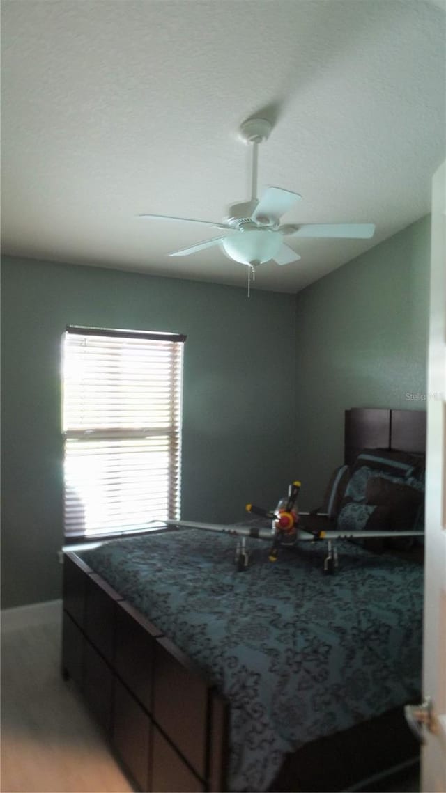 bedroom featuring a ceiling fan