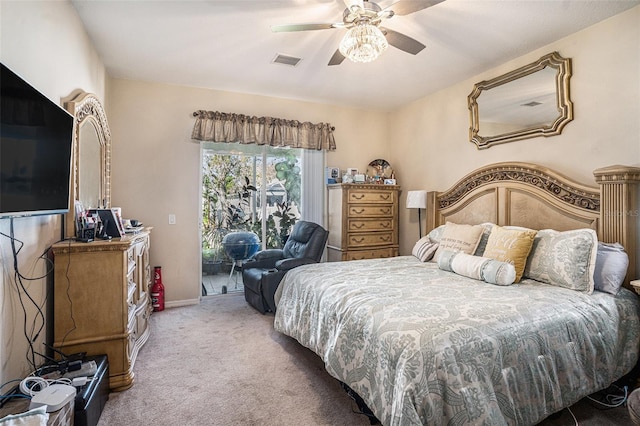 carpeted bedroom featuring ceiling fan, visible vents, baseboards, and access to exterior