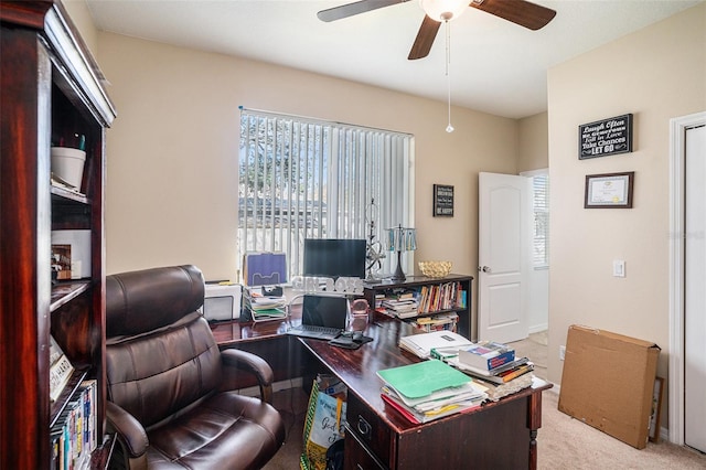 office space featuring light colored carpet and a ceiling fan