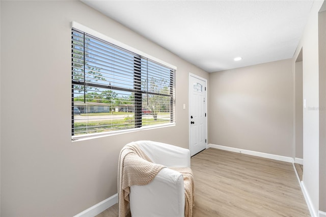 217 Emerald Ln, Largo, FL 33771 - entryway featuring plenty of natural light, baseboards, light wood finished floors, and recessed lighting
