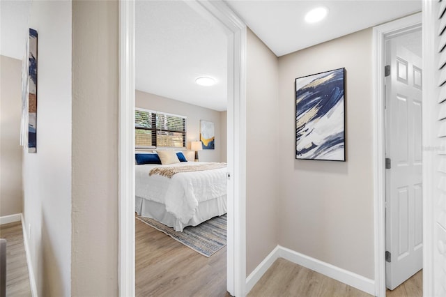 217 Emerald Ln, Largo, FL 33771 - corridor with light wood finished floors and baseboards