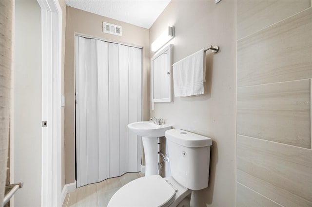 217 Emerald Ln, Largo, FL 33771 - bathroom with toilet, tile patterned flooring, and visible vents