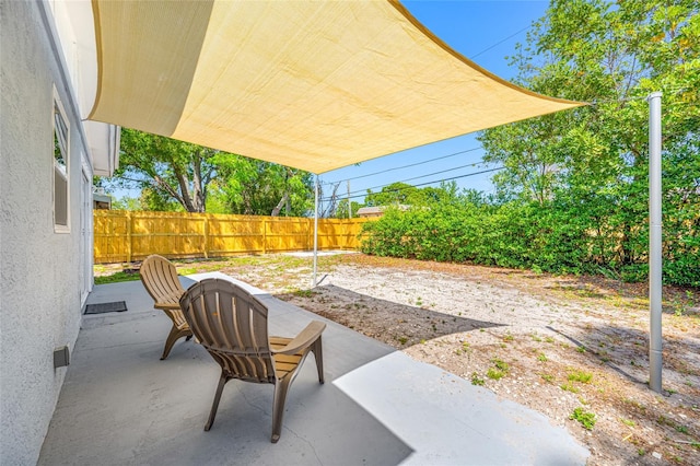 217 Emerald Ln, Largo, FL 33771 - view of patio featuring a fenced backyard
