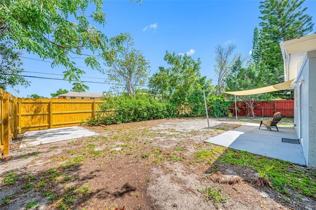 217 Emerald Ln, Largo, FL 33771 - view of yard featuring a fenced backyard and a patio area