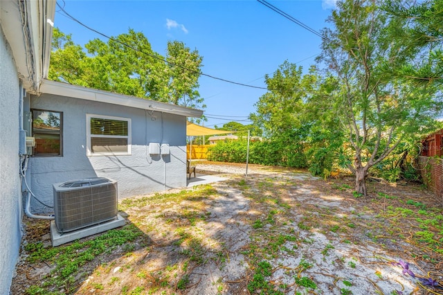 217 Emerald Ln, Largo, FL 33771 - view of yard featuring a fenced backyard and central air condition unit