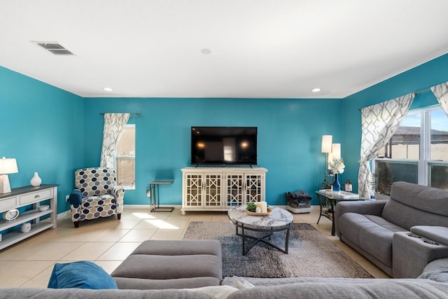 tiled living area with baseboards, recessed lighting, and visible vents
