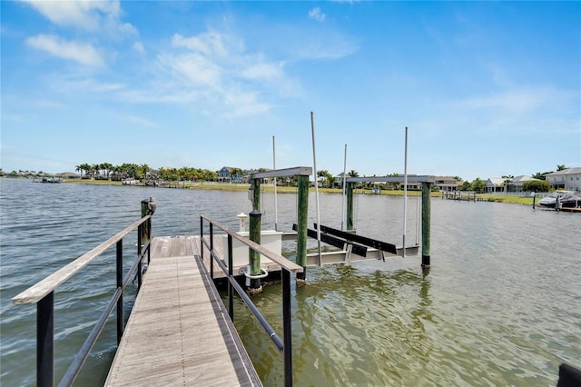 view of dock featuring a water view and boat lift