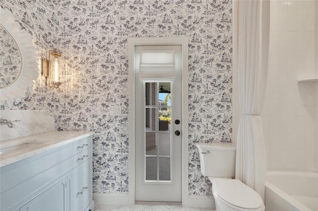 bathroom with wallpapered walls, toilet, vanity, and baseboards