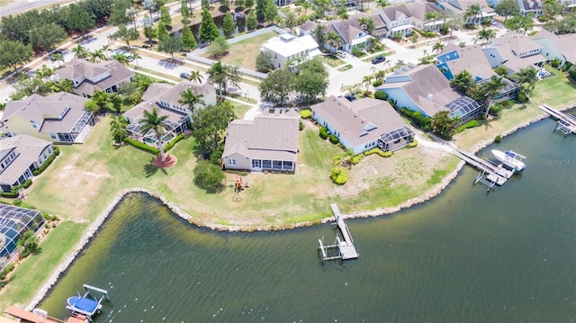 bird's eye view featuring a residential view and a water view