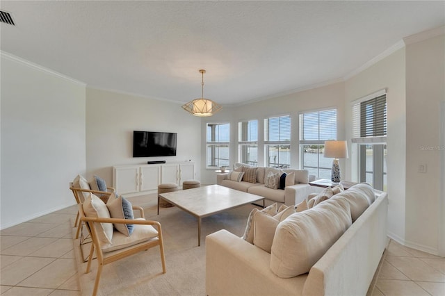 living area featuring light tile patterned floors, visible vents, baseboards, and ornamental molding