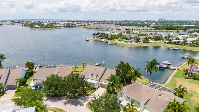 birds eye view of property featuring a residential view and a water view