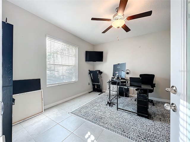 office space featuring tile patterned flooring, baseboards, and ceiling fan